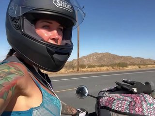 Felicity feline riding on aprilia tuono motorcycle